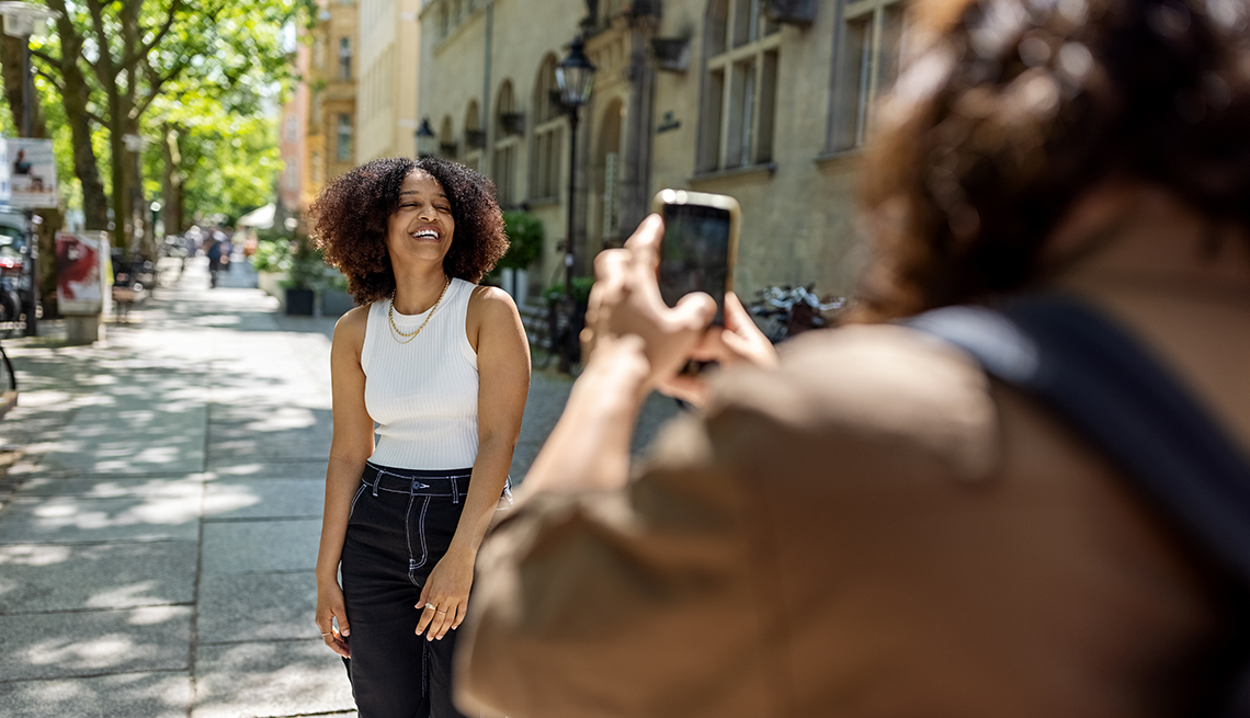 a woman is taking a picture of another woman