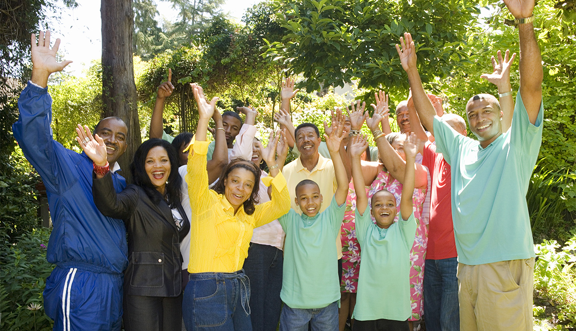 happy family, wearing assorted colors while standing outside