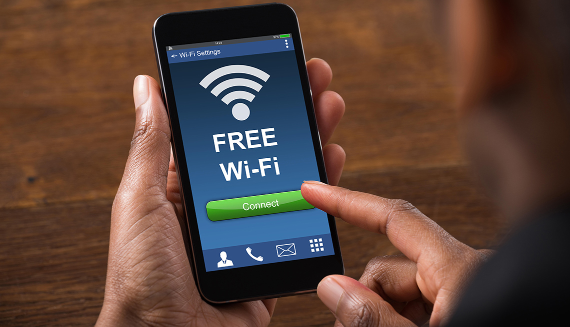 Close-up of Businessman Connecting To WiFi With Mobile Phone