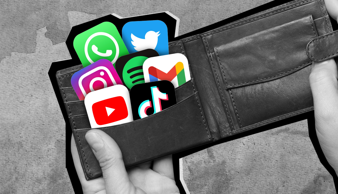 hands opening a wallet with app icons inside