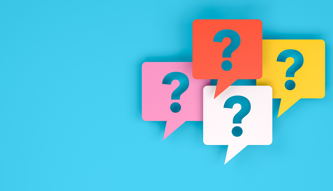 Signos de interrogación de colores sobre un fondo azul